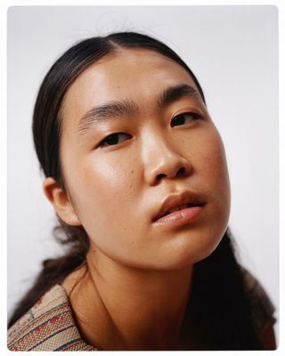 a close up of a person wearing a sweater