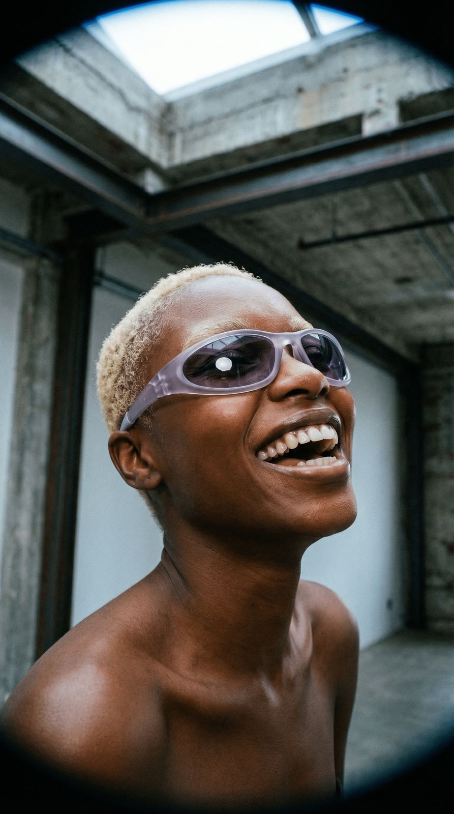 a man with sunglasses on his face smiling