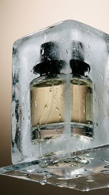 a couple of bottles of perfume sitting on top of a table