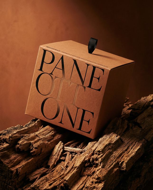 a cardboard box sitting on top of a pile of wood