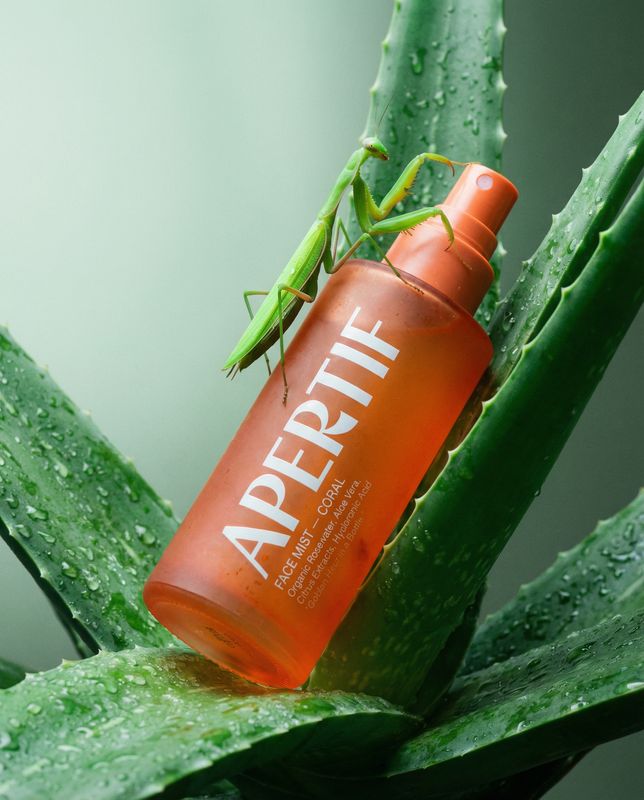 a close up of a bottle on a plant