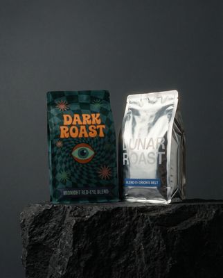 a bag of coffee sitting on top of a rock