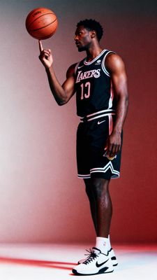 a man holding a basketball in his right hand