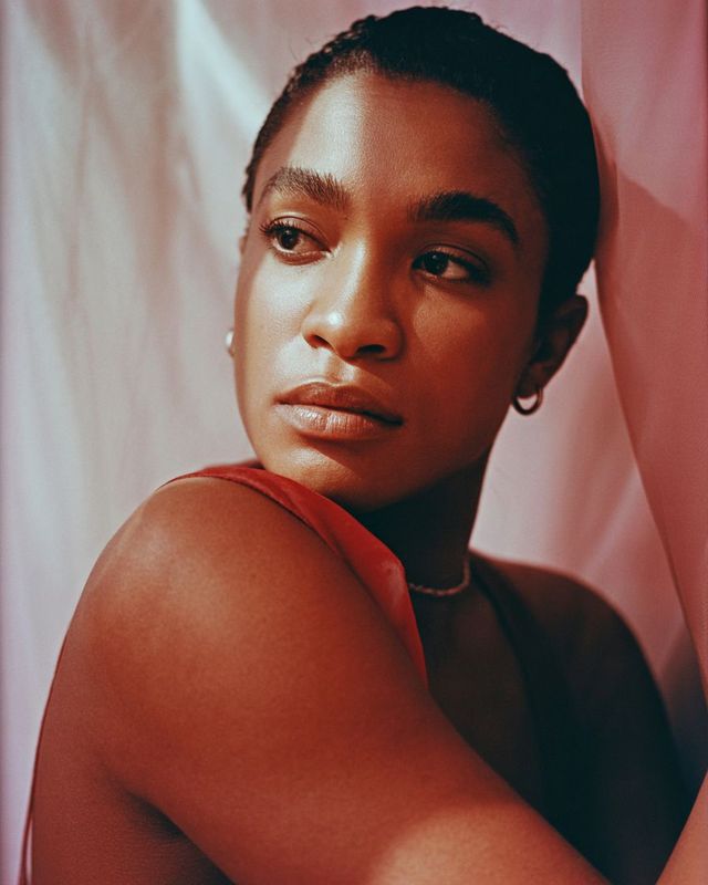 a close up of a person wearing a necklace