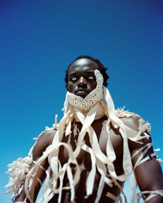 a man with a scarf around his neck