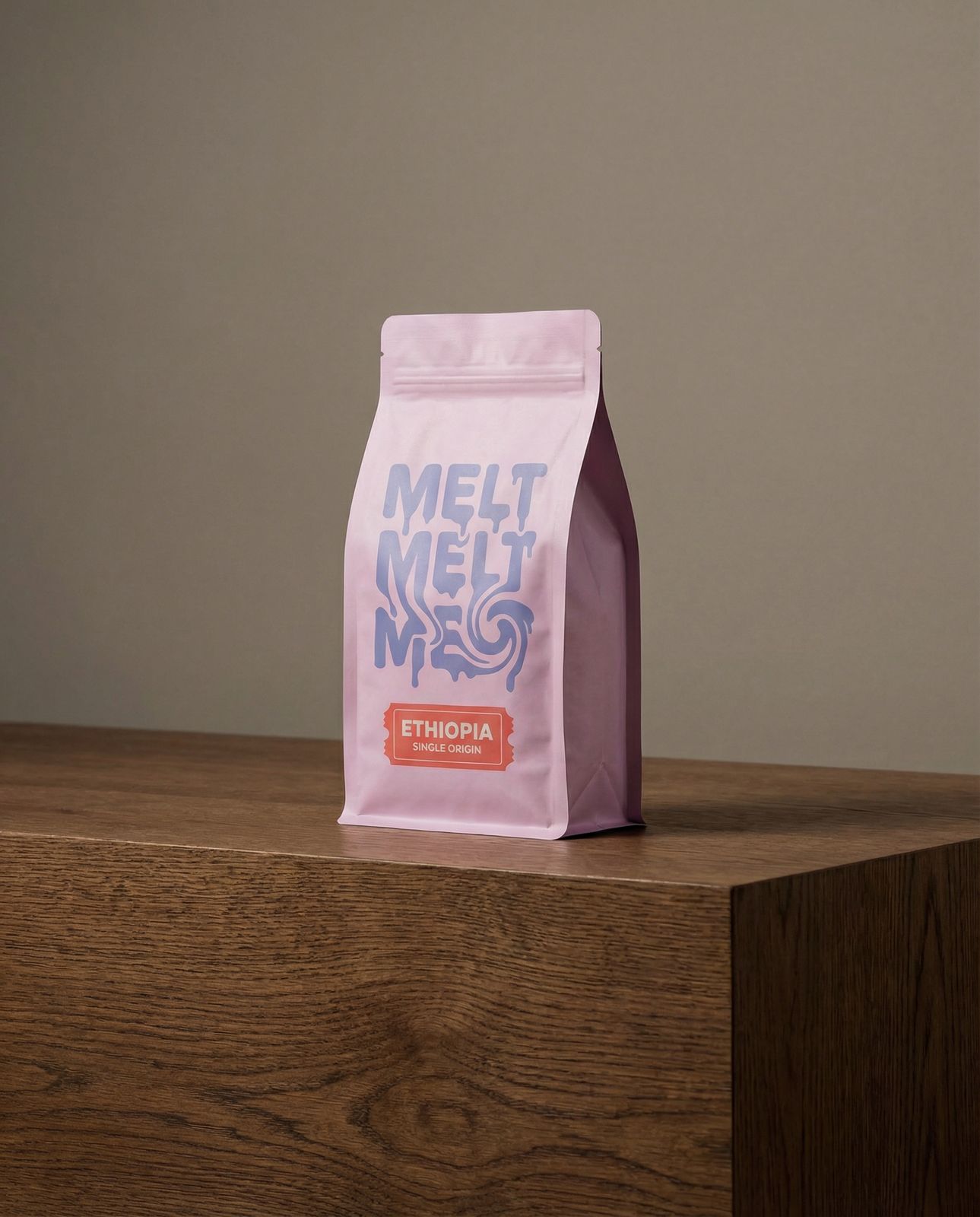 a bag of coffee sitting on top of a wooden table