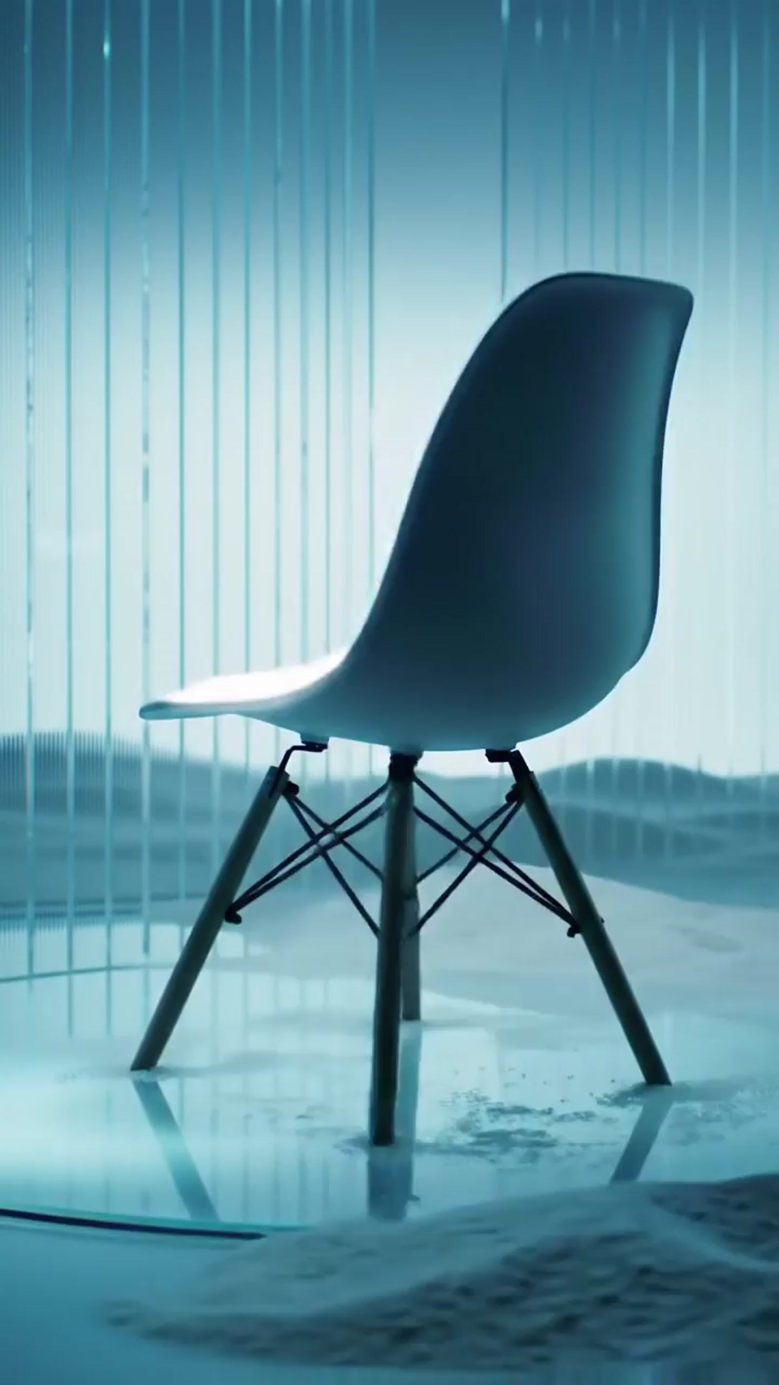 a white chair sitting in front of a window