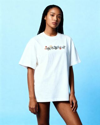 a woman wearing a white shirt and shorts