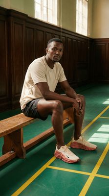 a man sitting on a bench in a building