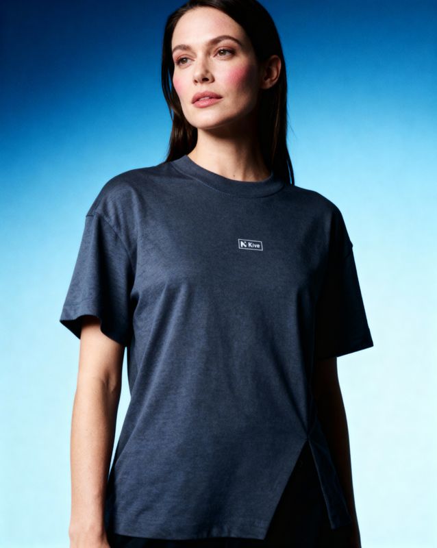 a woman standing in front of a blue background