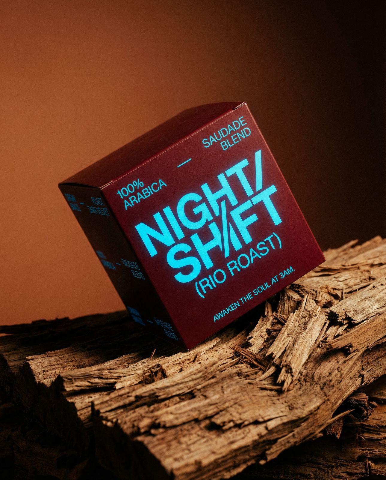 a box of night shift pro roast sitting on top of a pile of wood