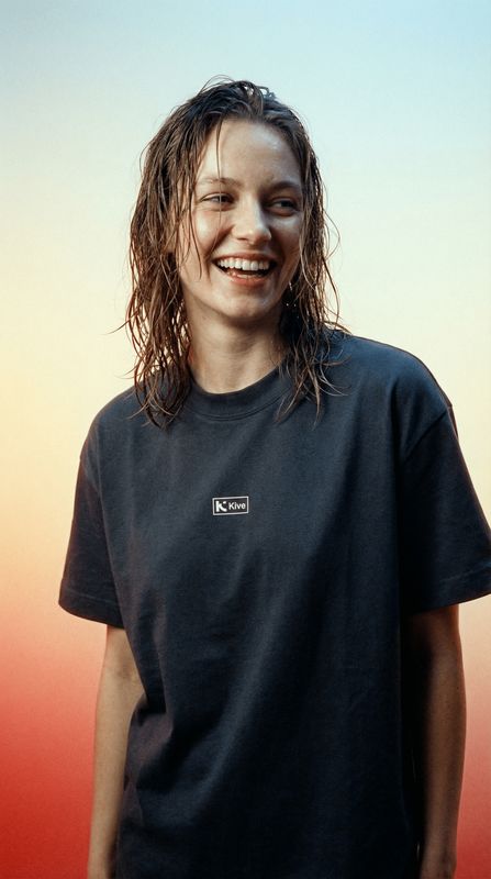 a man with wet hair and a black shirt