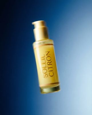 a bottle of oil flying through the air