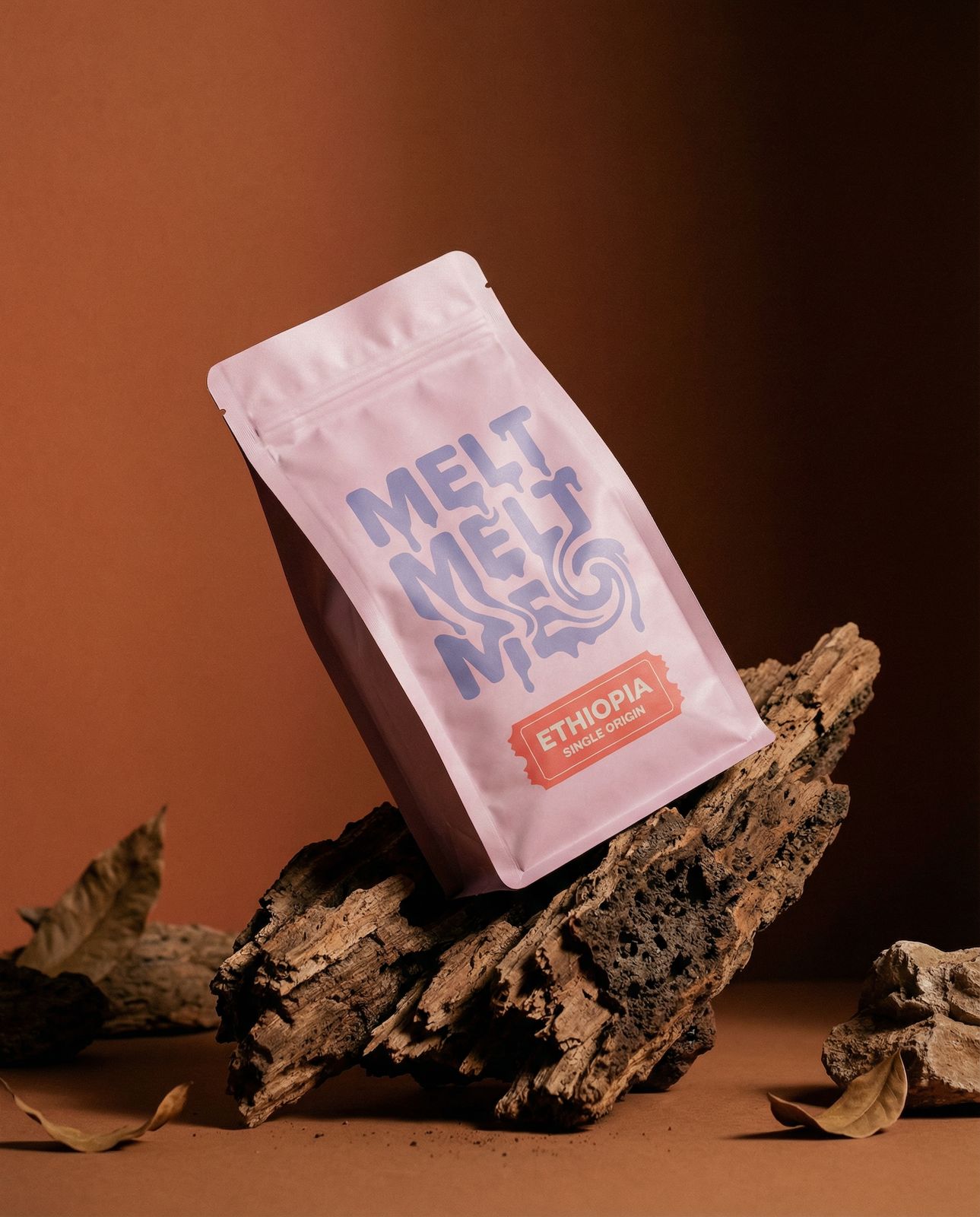 a bag of coffee sitting on top of a pile of wood