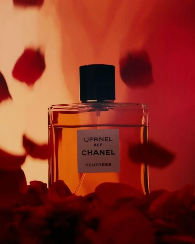 a bottle of perfume sitting on top of a table