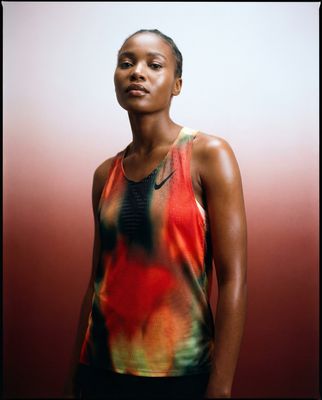 a woman in a tank top posing for a picture