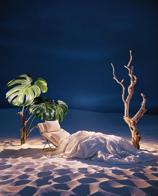 a chair sitting on top of a sandy beach