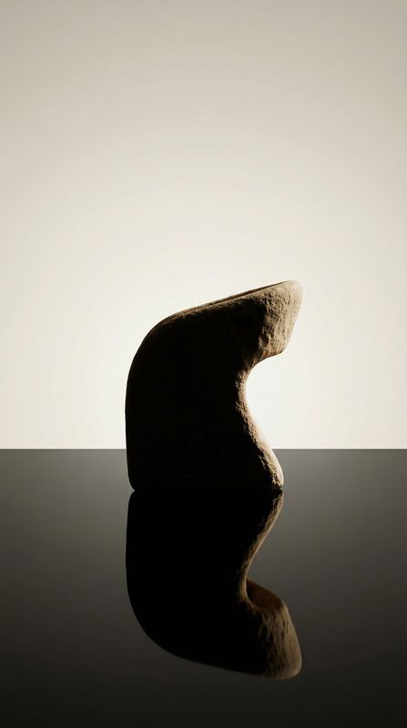 a rock sitting on top of a black table