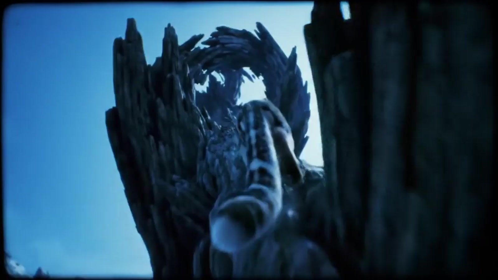 a close up of a statue of a bird on a tree