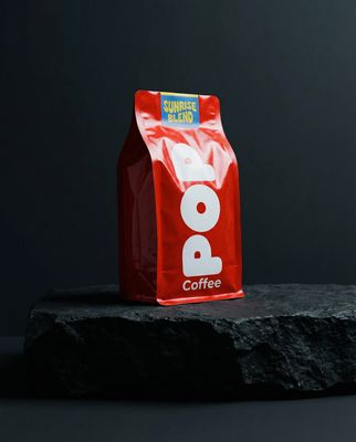 a bag of coffee sitting on top of a rock