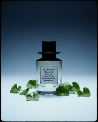 a bottle of perfume sitting on top of a table