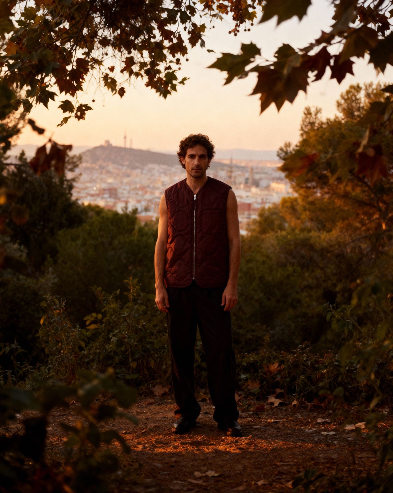 a man standing in the middle of a forest