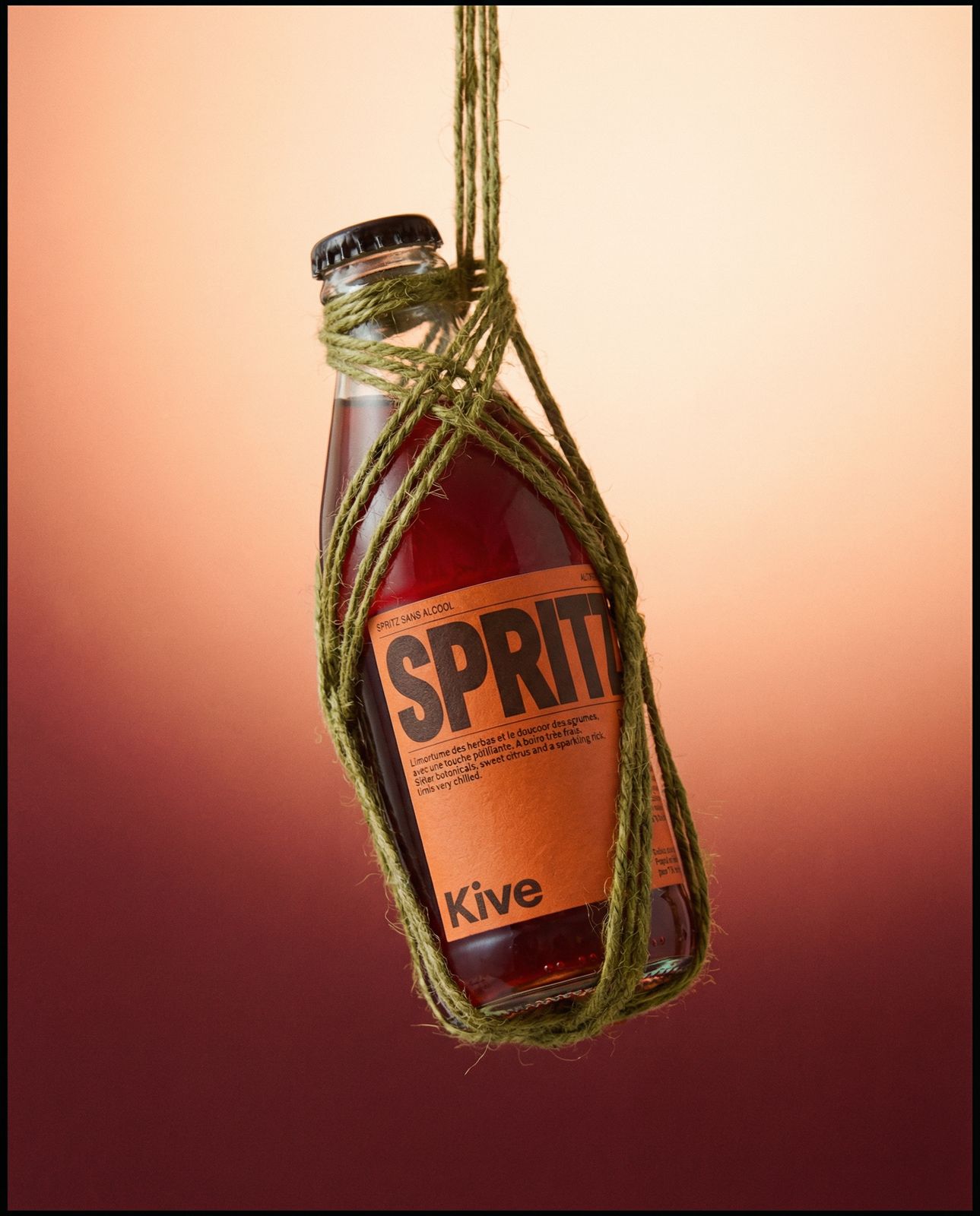 a bottle of wine hanging from a string