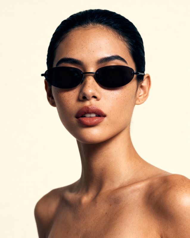 a woman wearing a pair of black sunglasses