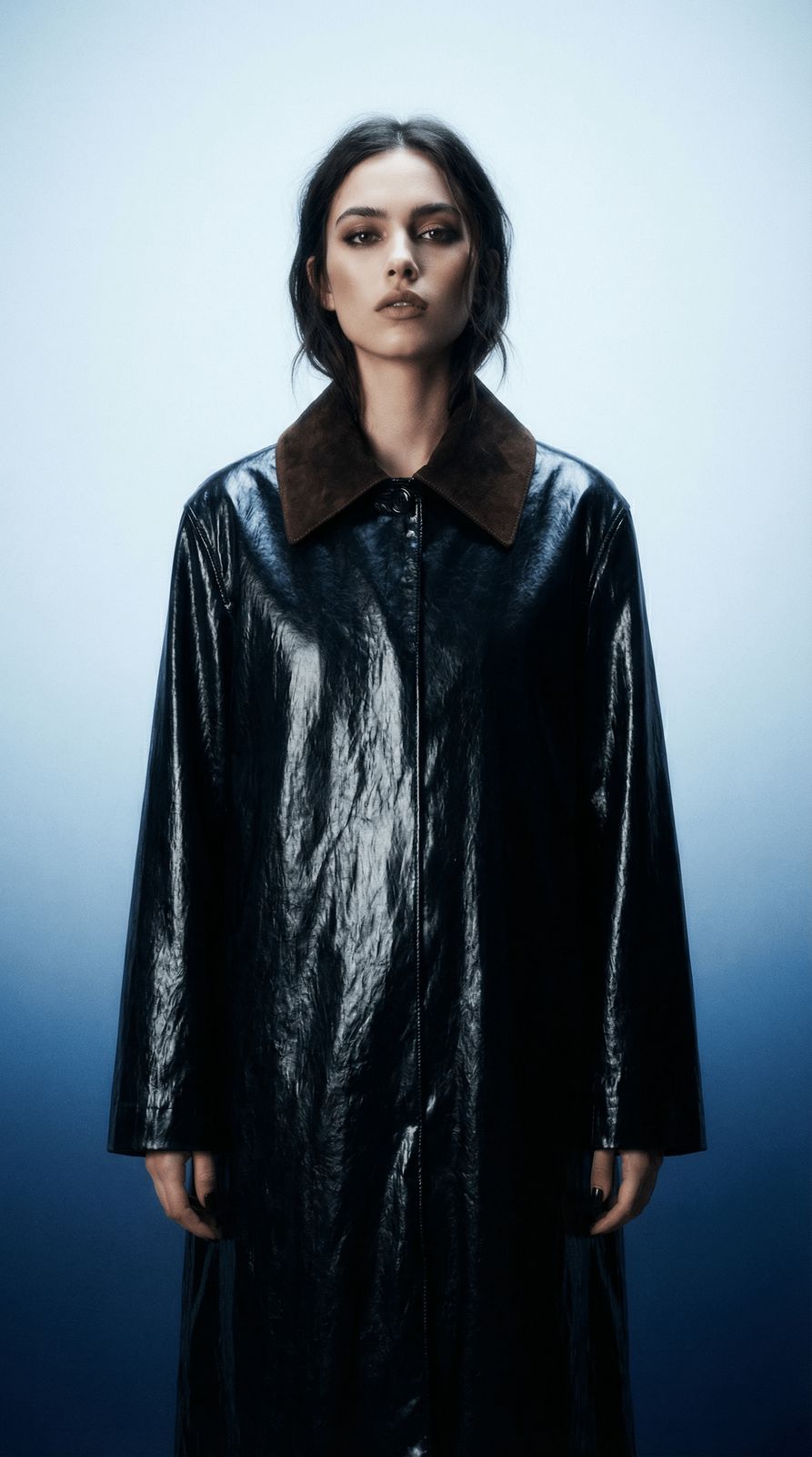 a woman wearing a black leather coat with a fur collar
