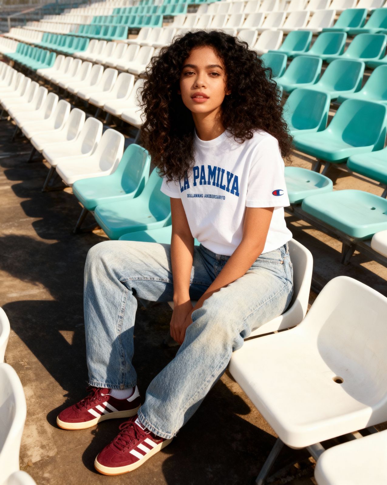 a woman sitting on a chair in a stadium