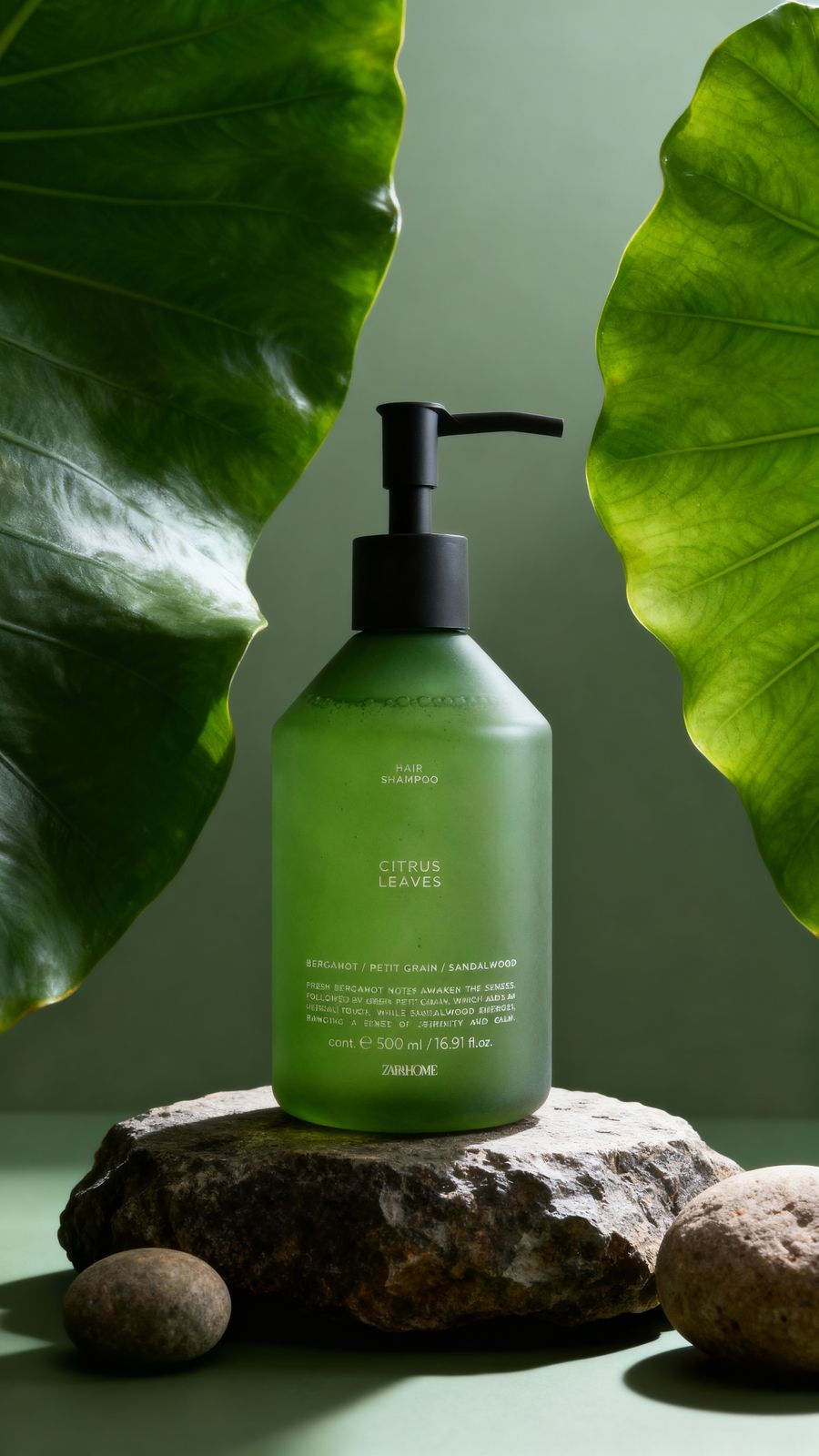 a bottle of green liquid sitting on top of a rock