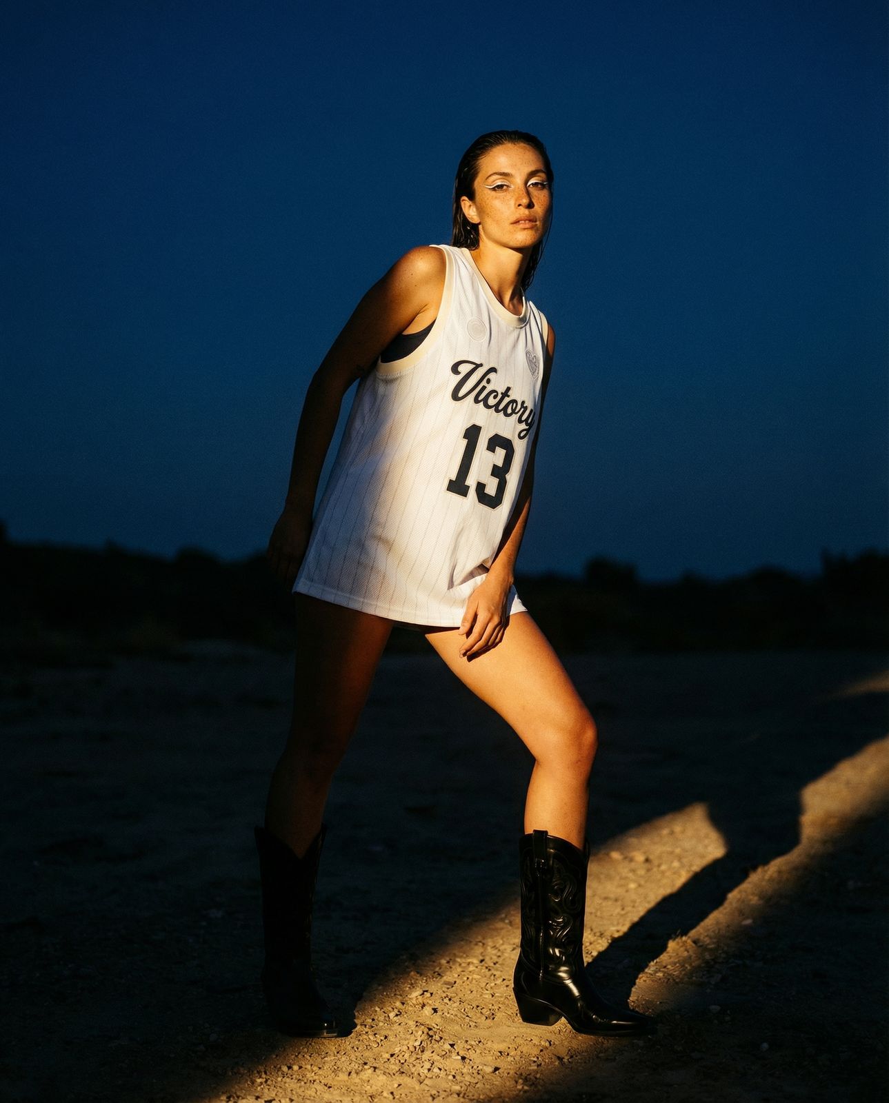 a female basketball player in a white uniform