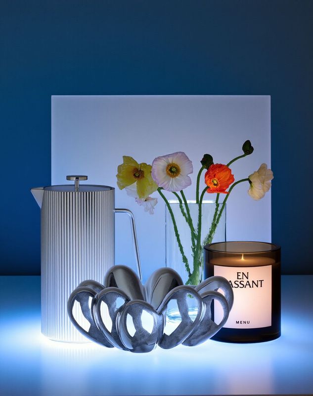 a candle and some flowers on a table