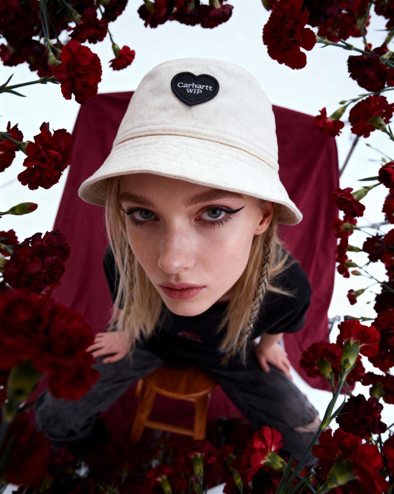 a girl wearing a hat and a black shirt