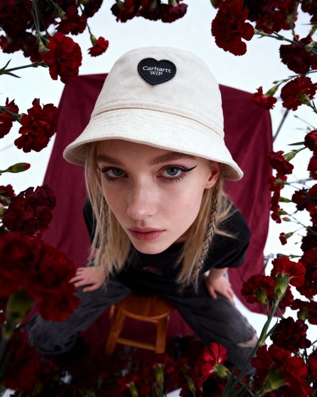 a girl wearing a hat and a black shirt