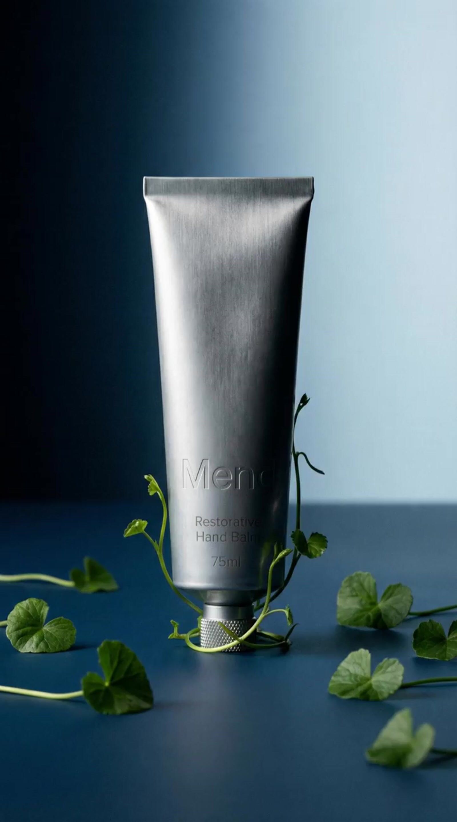 a tube of men's body lotion sitting on a table