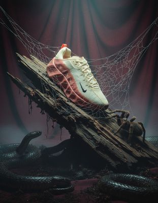 a pair of sneakers sitting on top of a piece of wood