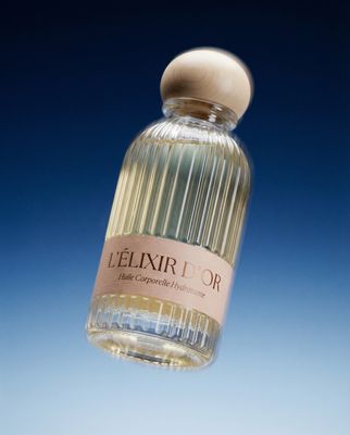 a bottle of perfume sitting on top of a table