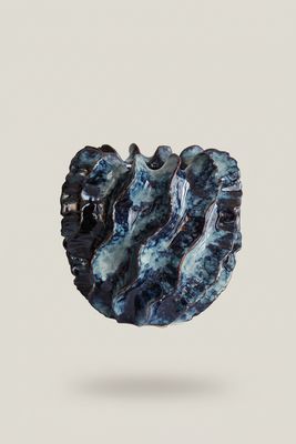 a black and blue object with a white background