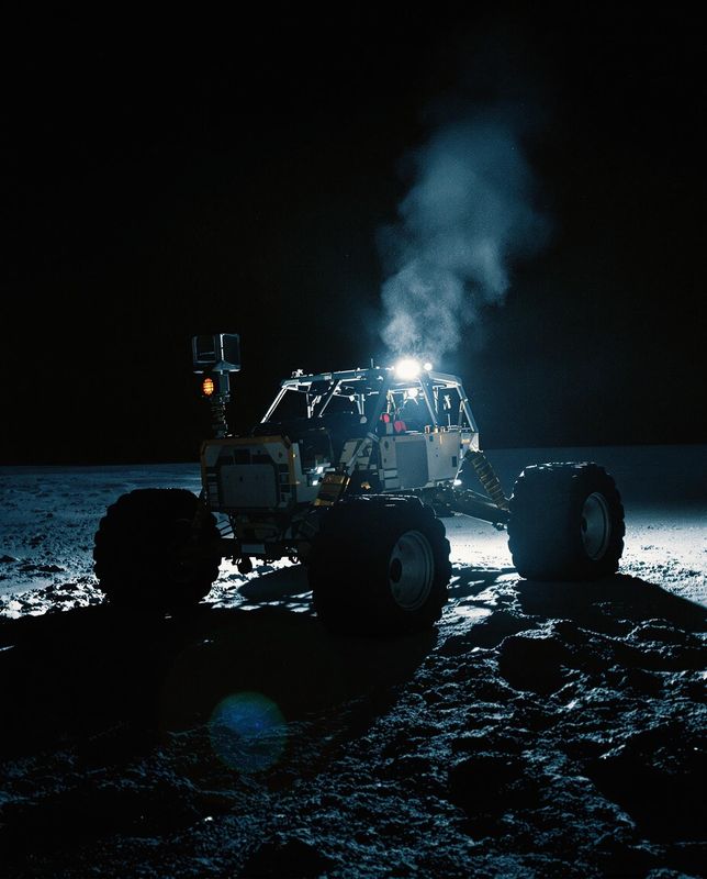 a tractor is parked on the beach at night