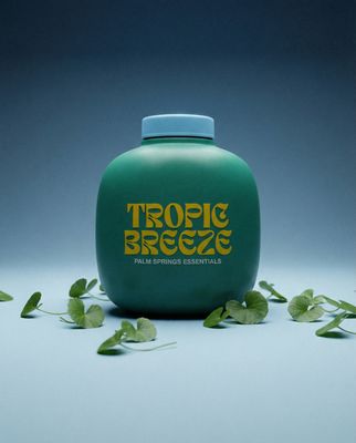 a bottle of tropic breeze water sitting on a table