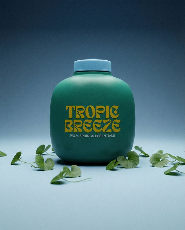 a bottle of tropic breeze water sitting on a table