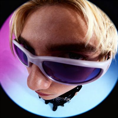 a woman wearing a pair of purple sunglasses