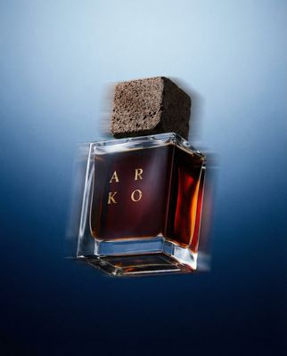 a bottle of perfume sitting on top of a table