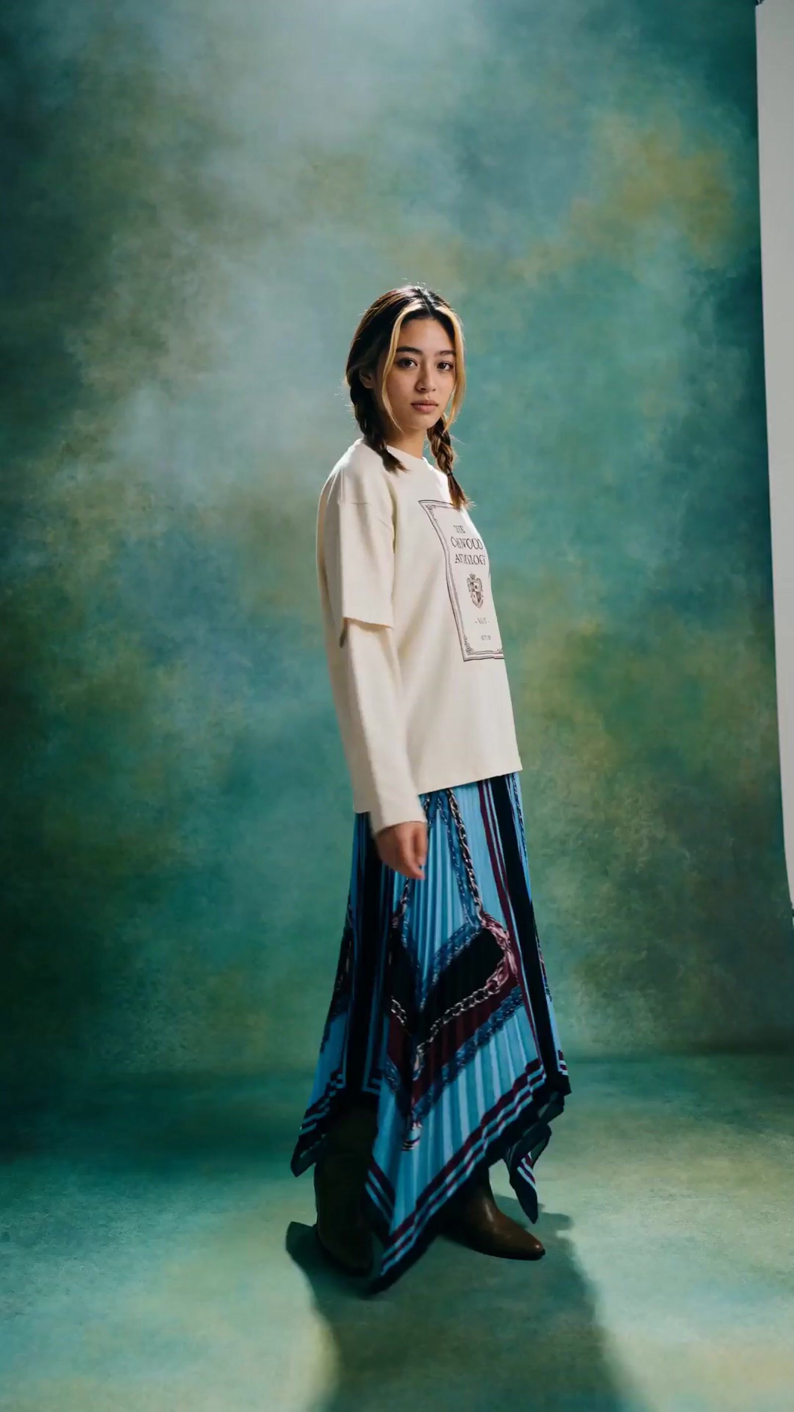 a young girl is posing for a picture