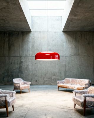 a room with several chairs and a lamp