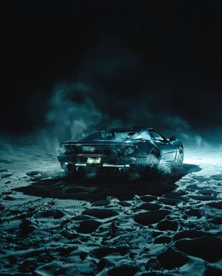 a car driving on a snowy road at night
