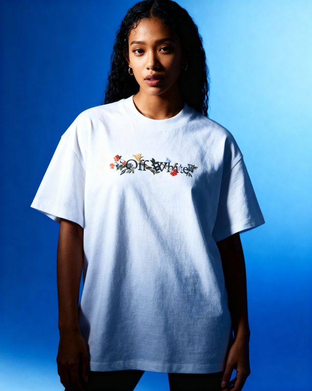 a woman standing in front of a blue background