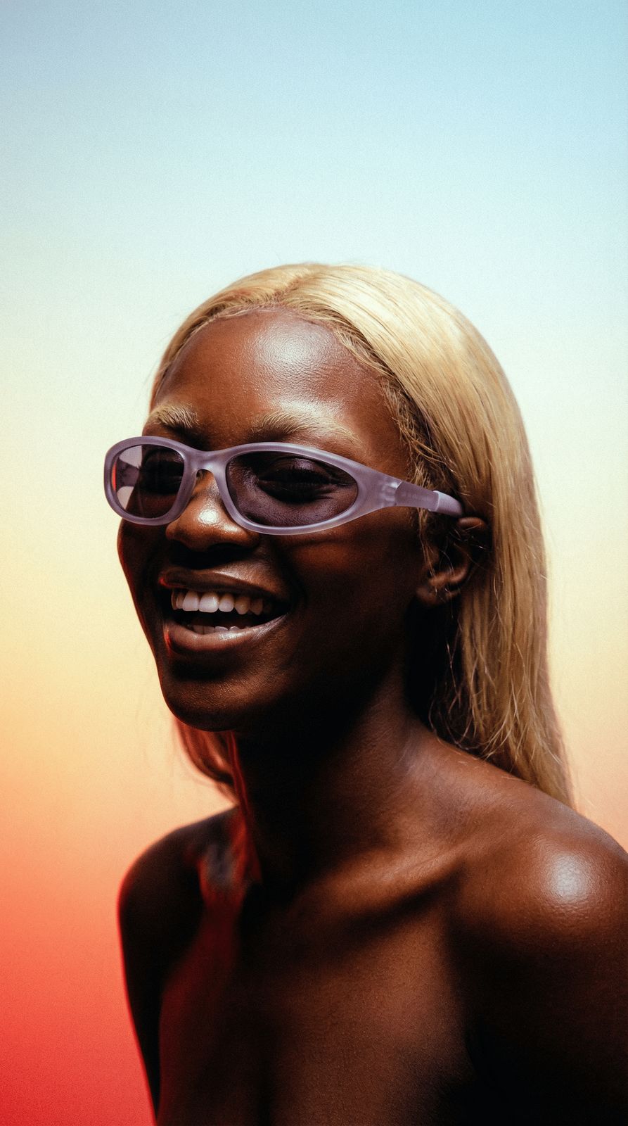 a black woman with sunglasses on her face