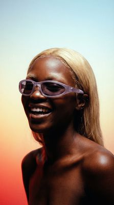 a black woman with sunglasses on her face